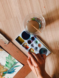 High angle view of person holding drink