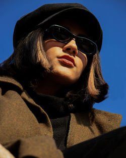 Portrait of young woman wearing sunglasses