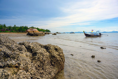 View of boats in sea against sky