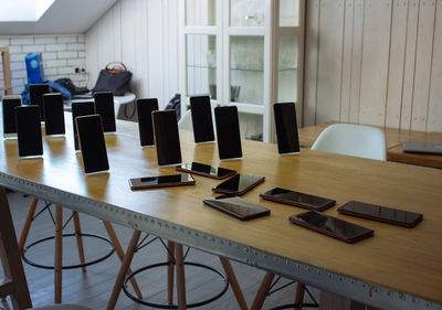 High angle view of mobile phones on table