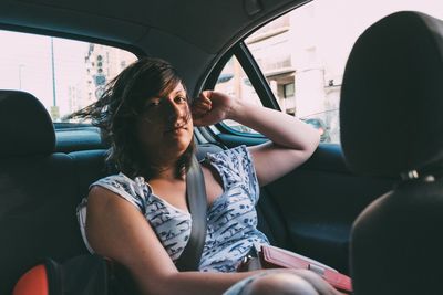 Close-up of woman sitting in car