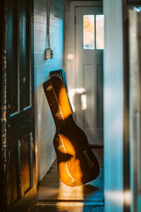 Close-up of beer bottle on glass window