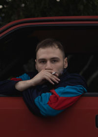 Portrait of man sitting in car