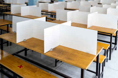 High angle view of empty chairs on table