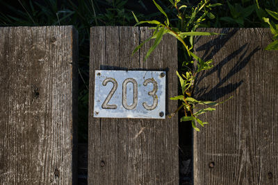 Text on wooden fence