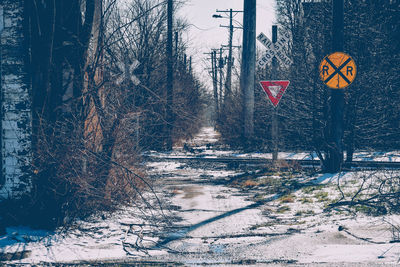 Railroad crossing at tracks during winter