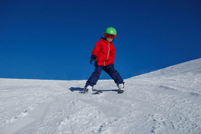 Full length of man skiing on snow