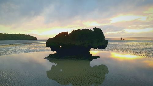 Scenic view of lake against sky during sunset