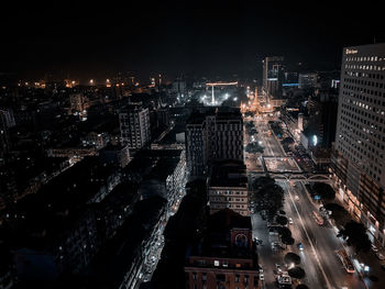 High angle view of illuminated city buildings at night