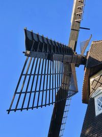 Low angle view of traditional building against clear blue sky