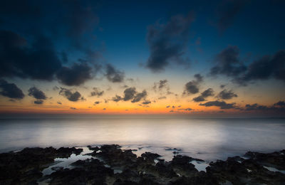 Scenic view of sea against sky during sunset