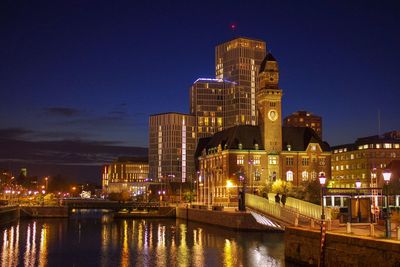 Illuminated buildings in city at night