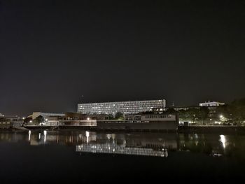 Illuminated buildings in city at night