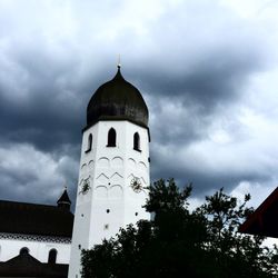 Low angle view of church against cloudy sky