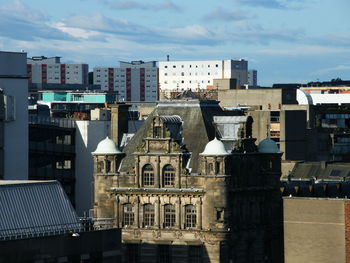 Buildings in city against sky