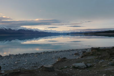 Scenic view of lake against sky during sunset