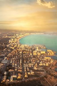 High angle view of city at sunset