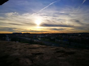 Scenic view of town against sky during sunset