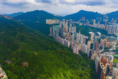 High angle view of buildings and mountains against sky