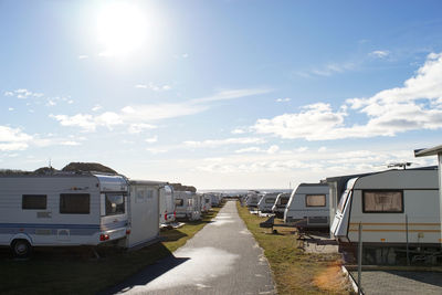 Cars on road against sky