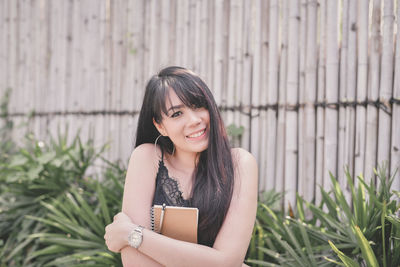 Portrait of smiling young woman