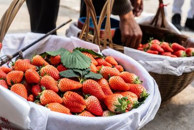 Close-up of strawberries in baskets at market