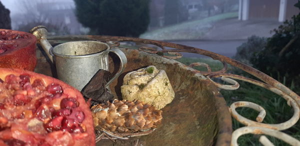 Close-up of fruits in container on table