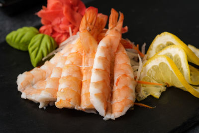 Close-up of dead fish in plate on table