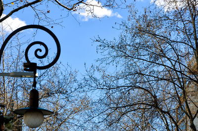 Low angle view of street light against sky