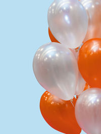 Low angle view of balloons against clear sky