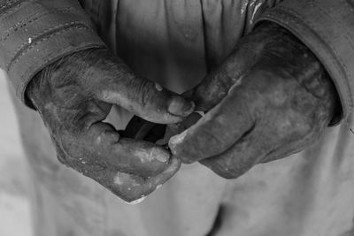 Close-up of man wit dirty hands