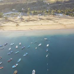High angle view of boats on sea shore