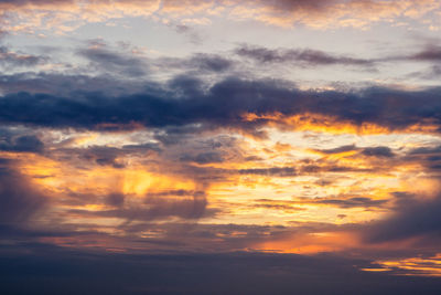 Low angle view of dramatic sky during sunset