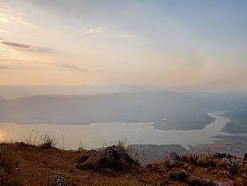 Scenic view of landscape against sky during sunset