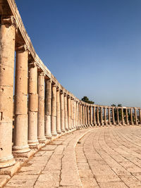 View of colonnade against clear sky