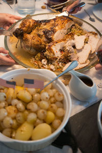 Sliced turkey on a family christmas table. side dishes around