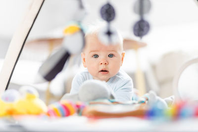 Portrait of boy playing with toys