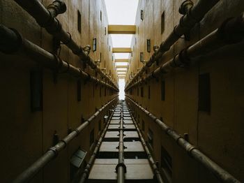 Low angle view of narrow alley