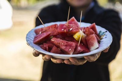 Close-up of man holding food