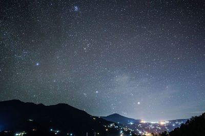 Scenic view of illuminated star field against sky at night