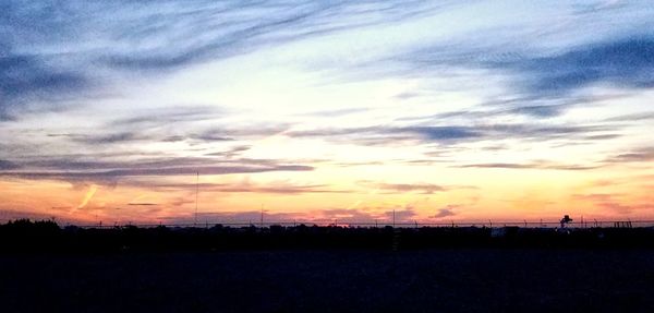 Scenic view of silhouette landscape against sky during sunset