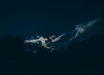 Scenic view of mountains at night