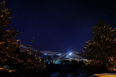 Scenic view of lake against sky at night