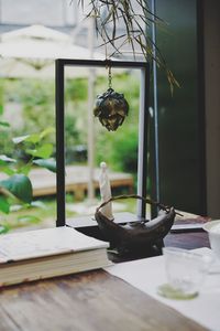 Close-up of wineglass on table against window