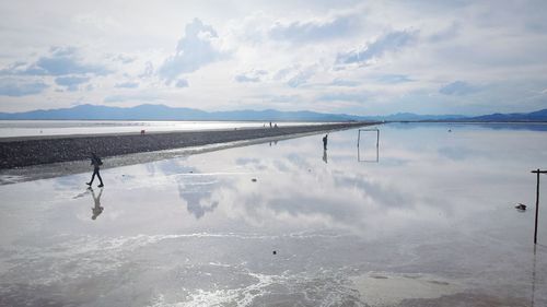 Cloudy sky reflecting on salt flat