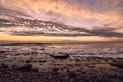 Scenic view of sea against sky during sunset