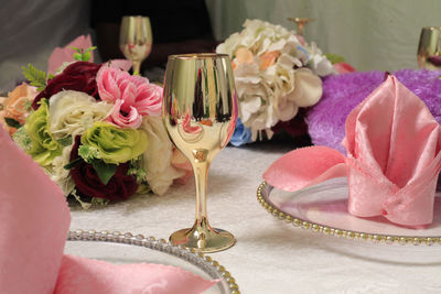 Close-up of pink roses on table