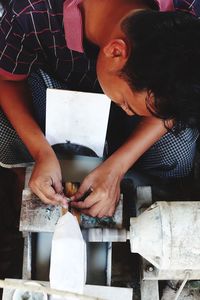 High angle view of manual worker working in factory