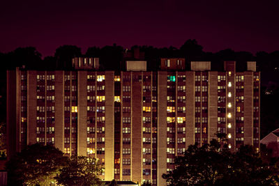 Illuminated buildings in city at night