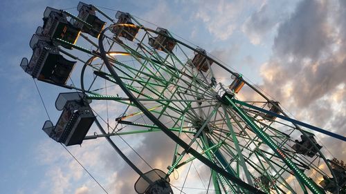 Low angle view of ferris wheel against sky